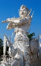 Sculpture soldier guards the entrance to the white temple in Chi