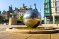 The sculpture stainless steel spheres and Sheffield Town Hall in Sheffield, UK
