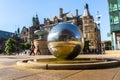 The sculpture stainless steel spheres and Sheffield Town Hall in Sheffield, UK