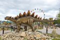 Sculpture of a stegosaurus close-up on a cloudy day. `Yurkin Park` - children`s themed entertainment park
