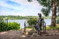 A sculpture of a summer resident girl on a bench in Plyos