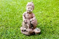 Sculpture thai girl doll with in the pebble garden