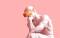 Sculpture Thinker With Golden VR Glasses On Pink Background