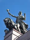 Sculpture of Torchbearer and lion Royalty Free Stock Photo