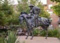 Sculpture of a trail boss cowboy sitting on a horse by Robert Summers in Plano, Texas.