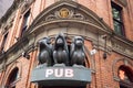 The Sculpture of Tree monkeys with different faces, No Speak, No See, No Hear on the gate of pub in Sydney