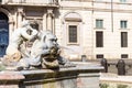 Sculpture of a triton, greek God. The Moor Fountain in Navona Square, Rome, Italy.