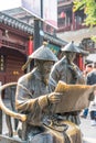 Sculpture of two examiners with official robes of Qing Dynasty in front of historical Jiangnan Examination Hall on Gongyuan Street