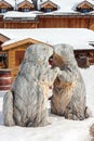 Sculpture of two man marmots in the snow