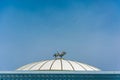 Sculpture of two storks on the domed roof Forums Palace in Tashk