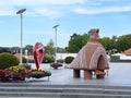 Sculpture of the Vucedol dowe with an old water tower and Dunav Hotel in the background, Vukovar - Slavonia, Croatia