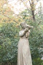 Sculpture woman with bird