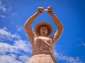 Sculpture of a woman holding fish