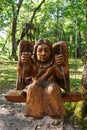 Sculpture of a wooden angel in a public park Royalty Free Stock Photo