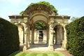 Sculptured archway & urn on a plinth at the Italian garden of Hever castle in England