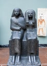 Sculptured black granite stone Egyptian man and woman couple