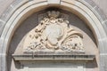 A sculptured blazon and plant motives decorate the facade of a building (France) Royalty Free Stock Photo