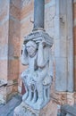 The sculptured column base at the entrance of Piacenza Cathedral, Italy