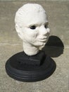 Sculptured head on a pedestal