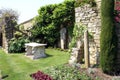 Sculptured marble table & statue at the Italian garden of Hever castle in England