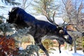 Sculptured Moose Coming out of the forest and snow.