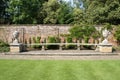 Sculptured stone seat or bench with lidded urns