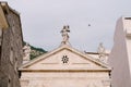 Sculptures above the entrance to the Catholic Church of Saint apostle Mark. Montenegro