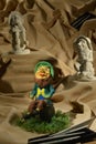 Sculptures of clay leprechauns in the cloth sands