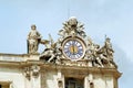 Sculptures and clock on the facade of Vatican city works Royalty Free Stock Photo