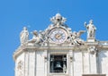 Sculptures and clock on the facade of Vatican city works. Vatican. Rome. Italy.