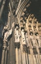 Sculptures on Cologne Cathedral, historic architecture background