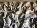 Bas relief rock cut sculptures of gods, people and animals are carved prominently in the monolithic cave temples at Mahabalipuram, Royalty Free Stock Photo