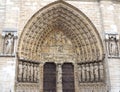 Sculptures at main entrance to cathedral Notre Dame de Paris. Notre Dame-famous Gothic, Roman Catholic cathedral in Paris, France Royalty Free Stock Photo