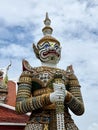 The sculptures of mythical giant demons, Sahatsadecha, guarding the eastern gate of the main chapel of Wat Arun Ratchawararam