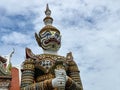 The sculptures of mythical giant demons, Sahatsadecha, guarding the eastern gate of the main chapel of Wat Arun Ratchawararam, is