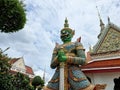 The sculptures of mythical giant demons, Thotsakan, guarding the eastern gate of the main chapel of Wat Arun Ratchawararam, is a