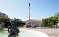 Sculptures of the South fountain in the Rossio Square, the Column of D. Pedro IV in the background, Lisbon, Portugal Royalty Free Stock Photo