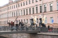 Sculptures of 2 sphinxes with Golden wings on the bridge in St. Petersburg, tourists, old building, October 2019