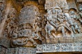 Sculptures on the west side walls. Ravana lifting Kailasa on the left and Shiva-Parvati on Nadi on the right. Hoysaleshwara temple