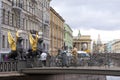 Sculptures of winged sphinxes on the Bank bridge in St. Petersburg, tourists, old buildings, Church of the Savior on spilled blood
