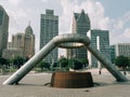 Scupture and view of buildings in downtown Detroit, at Hart Plaza