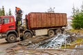 Scutec, Czech Republic, 21 November 2019: A grapple truck loads scrap industrial metal for recycling.