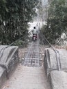 A scuty running beautiful hanging bridge scene in Nepal