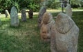 Scythian stone women on the lawn near the city museum. Ancient gray stone sculptures.