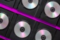 SD Blu-ray discs in open black boxes on a purple background Royalty Free Stock Photo