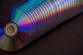 sd and dvd disks on a dark background. large stack. Royalty Free Stock Photo