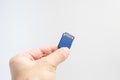 SD memory card with hand and finger hold isolate on white background. Royalty Free Stock Photo