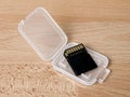SDHC memory card in plastic container on desk Royalty Free Stock Photo