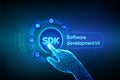 SDK. Software development kit programming language technology concept on virtual screen. Technology Concept. Robotic hand touching Royalty Free Stock Photo