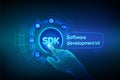 SDK. Software development kit programming language technology concept on virtual screen. Technology Concept. Robotic hand touching Royalty Free Stock Photo